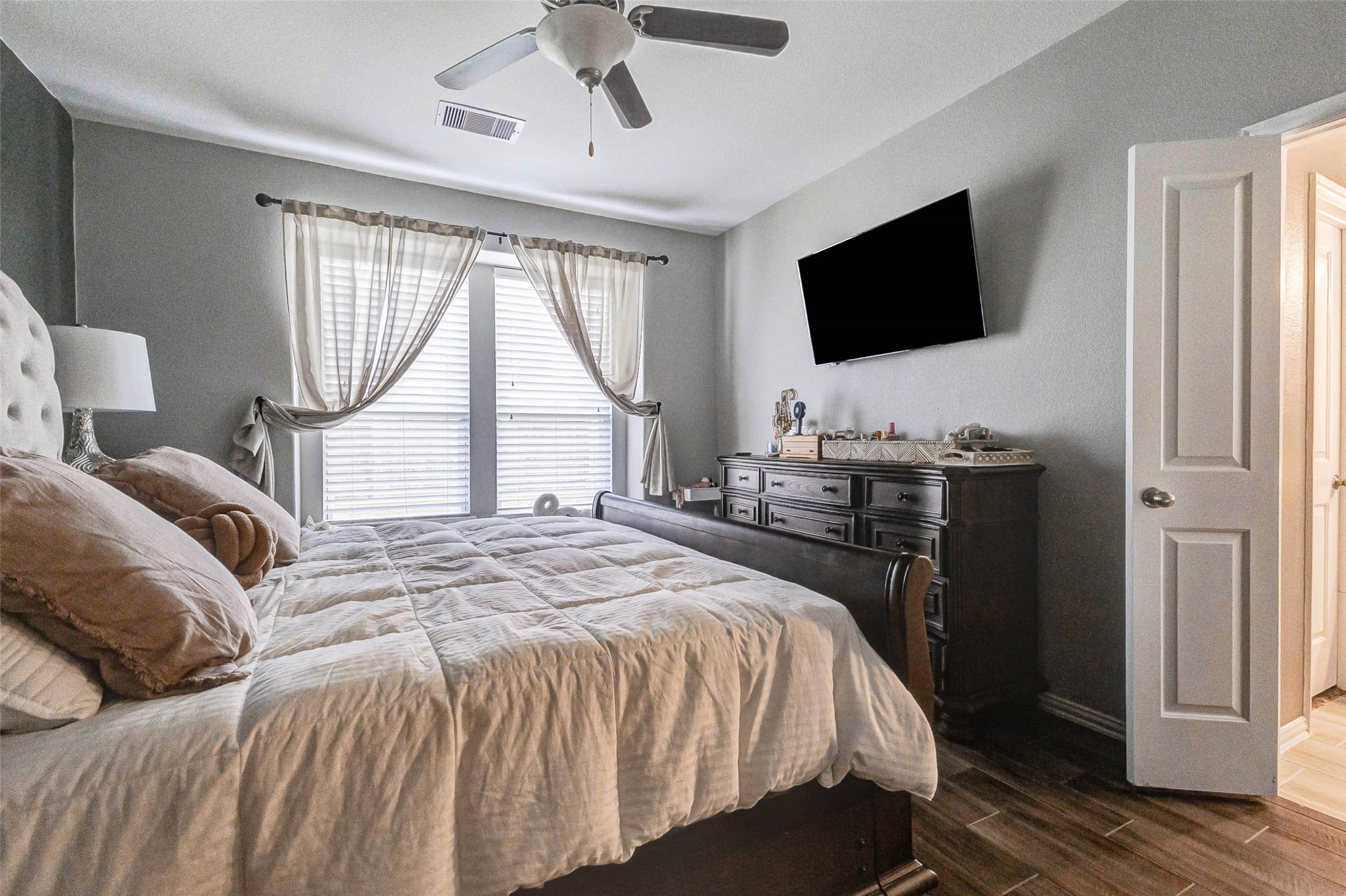3210 Montclair Orchard Trace Spring, TX 77386 - Photo 27 of 38 a bedroom with a bed television on desk and a window
