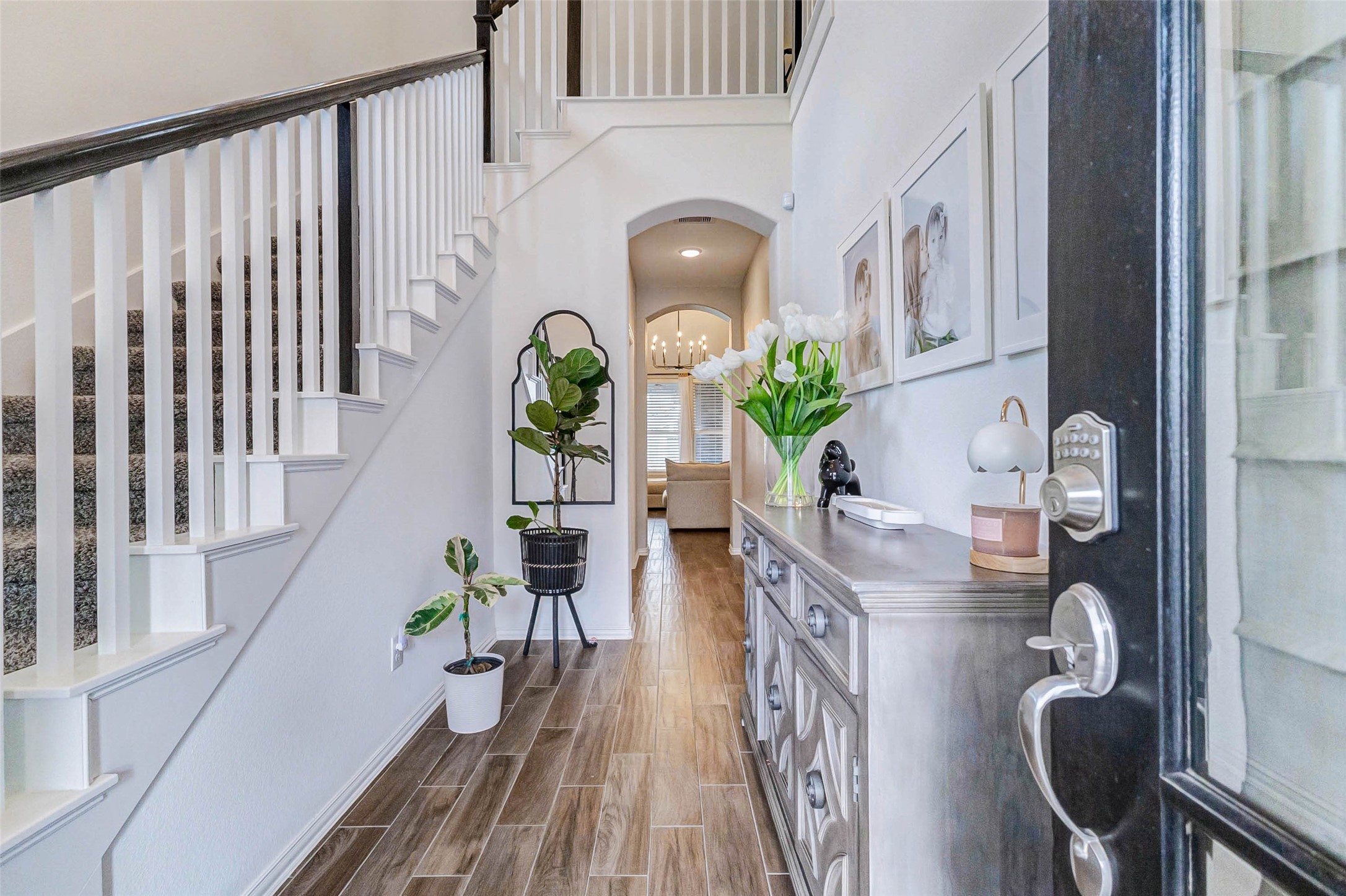 3210 Montclair Orchard Trace Spring, TX 77386 - Photo 6 of 38 a living room with wooden floor furniture and a potted plant