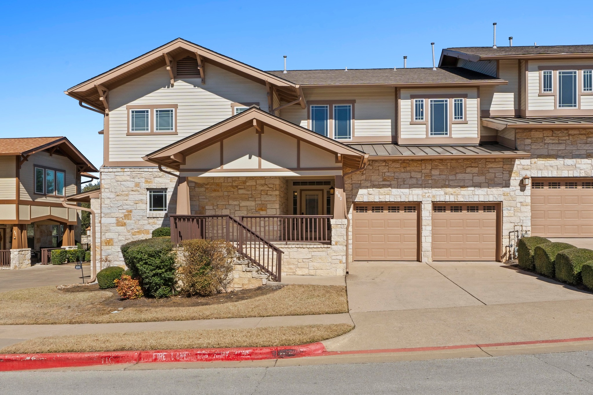 2930 Grand Oaks Loop, Unit 603 Cedar Park, TX 78613 - Photo 1 of 29 View of the front of the home with stone siding, an attached garage, and a concrete driveway