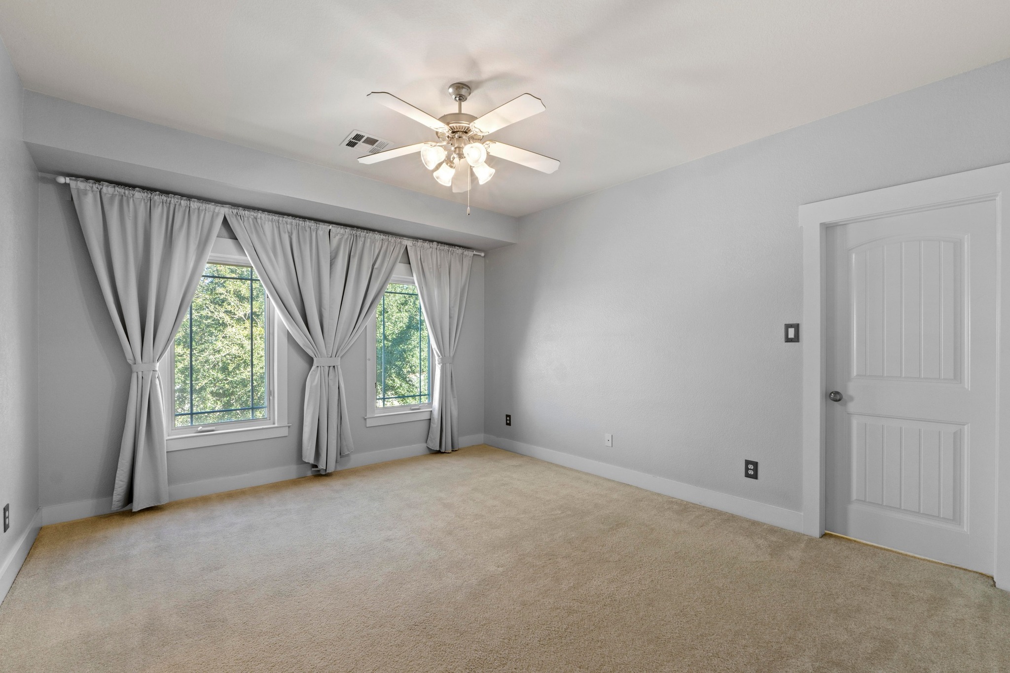 2930 Grand Oaks Loop, Unit 603 Cedar Park, TX 78613 - Photo 13 of 29 Large primary bedrooms, light carpet, and ceiling fan, walk in closet