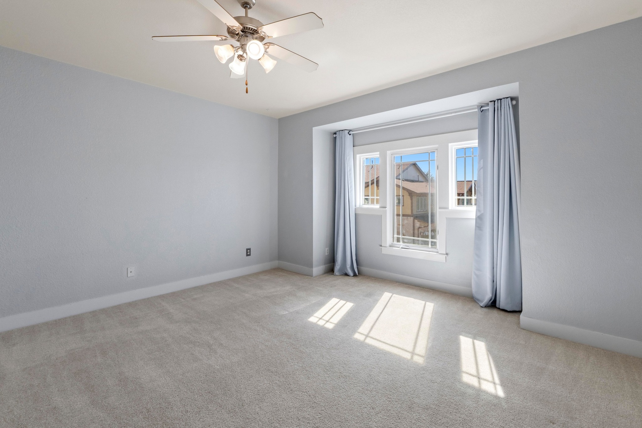 2930 Grand Oaks Loop, Unit 603 Cedar Park, TX 78613 - Photo 19 of 29 !st and larger guest bedroom featuring light carpet and a ceiling fan