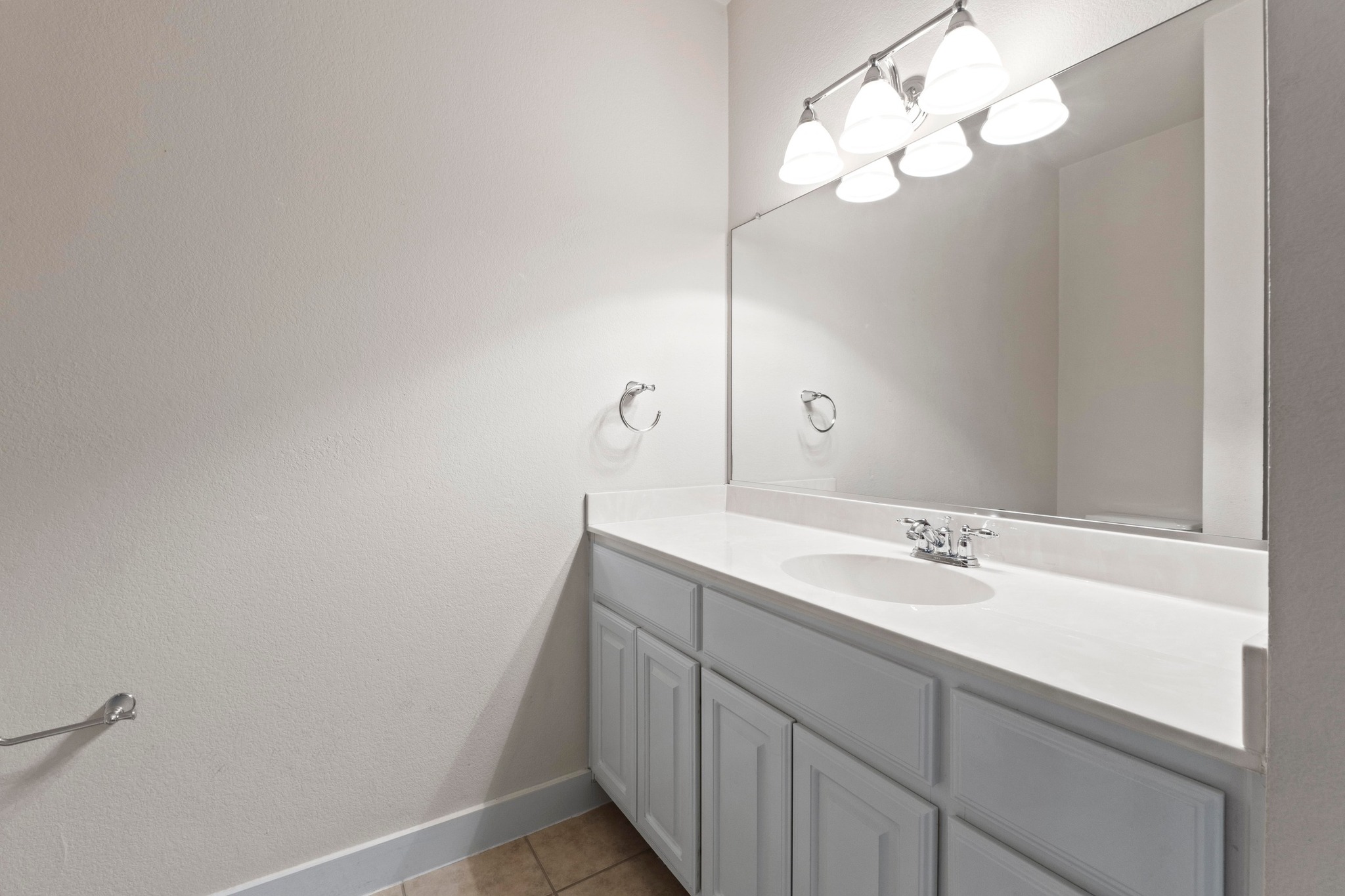 2930 Grand Oaks Loop, Unit 603 Cedar Park, TX 78613 - Photo 20 of 29 Bathroom with vanity and light tile patterned flooring