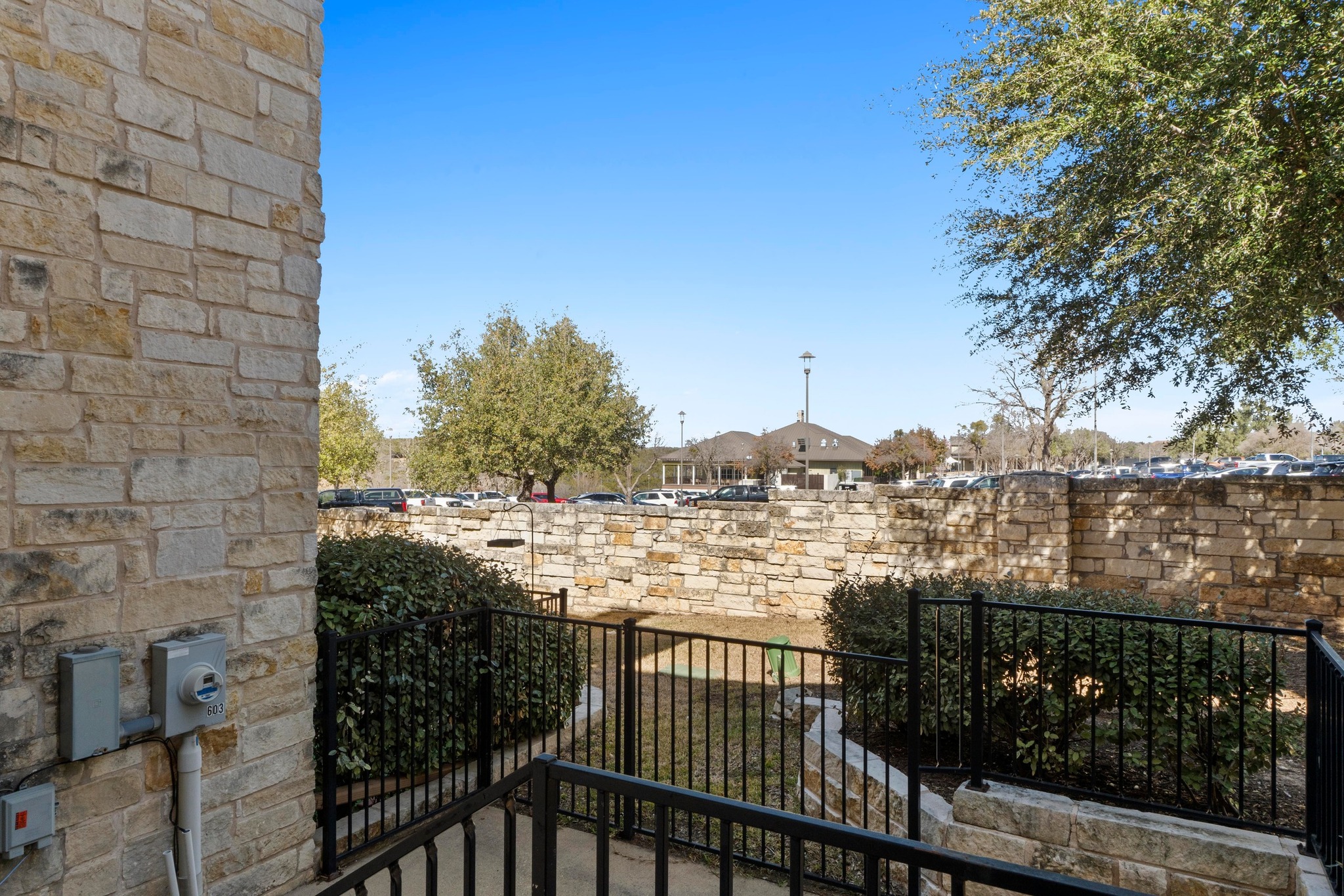2930 Grand Oaks Loop, Unit 603 Cedar Park, TX 78613 - Photo 26 of 29 Gate featuring a balcony and a residential view
