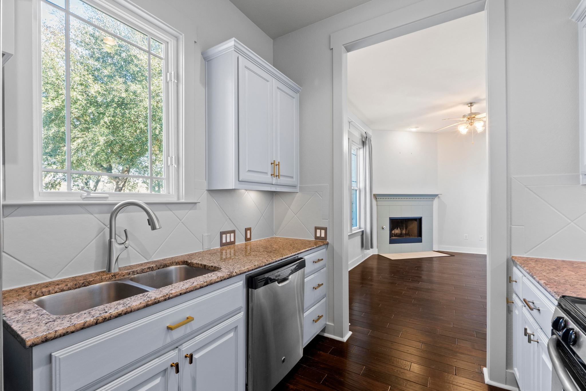 2930 Grand Oaks Loop, Unit 603 Cedar Park, TX 78613 - Photo 10 of 29 Kitchen with light stone countertops, stainless steel appliances, backsplash
