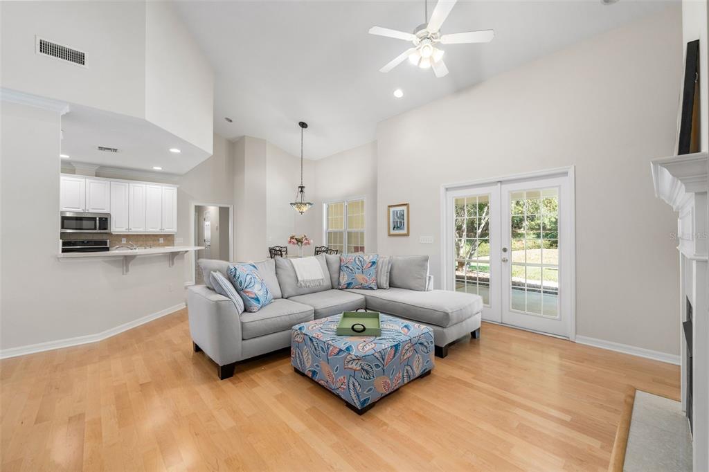 7418 White Oaks Road Alachua, FL 32615 - Photo 9 of 46 a living room with furniture and a large window