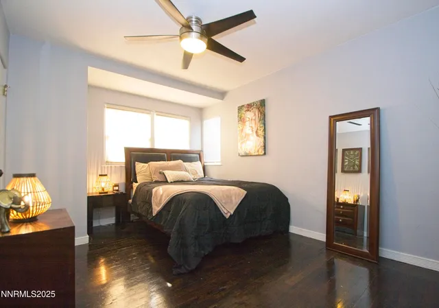 a bed room with a bed and a tv