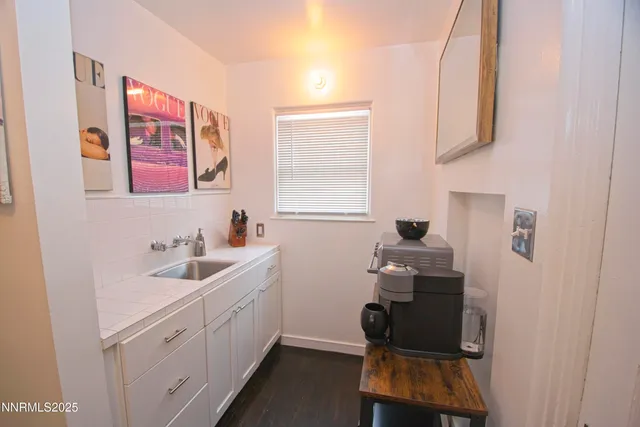 a bathroom with a sink and a window