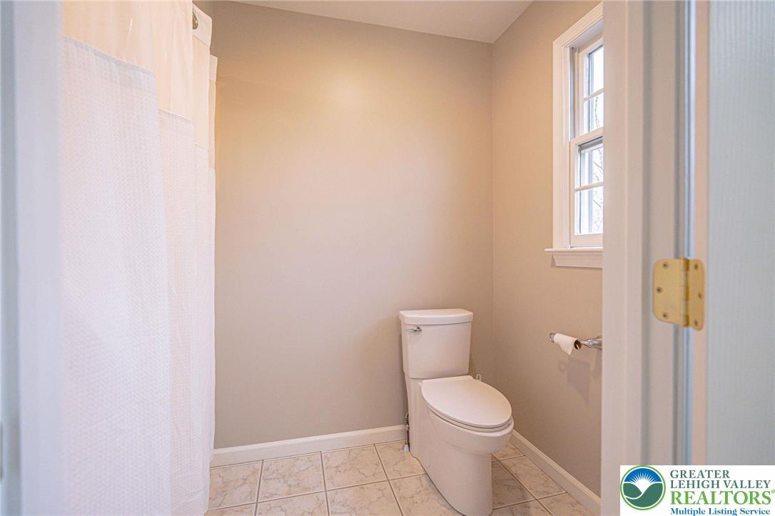 6551 Overlook Road Orefield, PA 18069 - Photo 58 of 82 a white toilet sitting next to a window