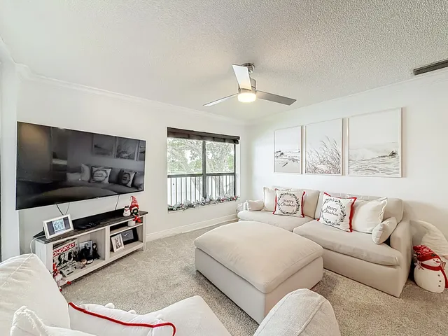 a spacious bedroom with a bed and a large window