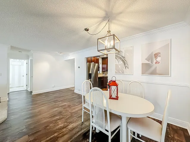 a en suite bathroom with a granite countertop sink and a mirror