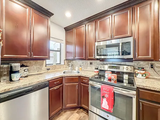 a view of a dining room with furniture kitchen and wooden floor