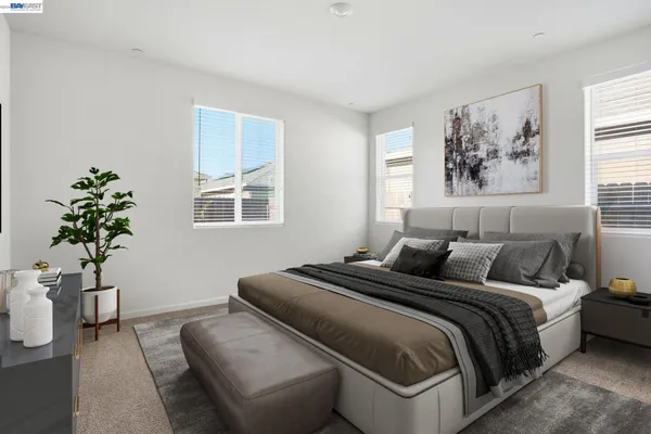 a bedroom with a bed and a couch