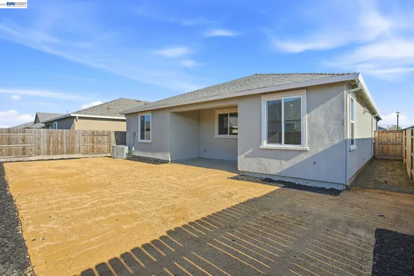 a house view with a backyard space