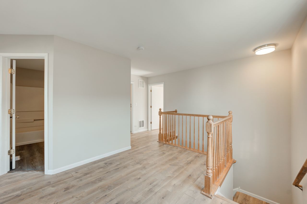 277 Springbrook Trail South Oswego, IL 60543 - Photo 12 of 28 a view of a room with wooden floor