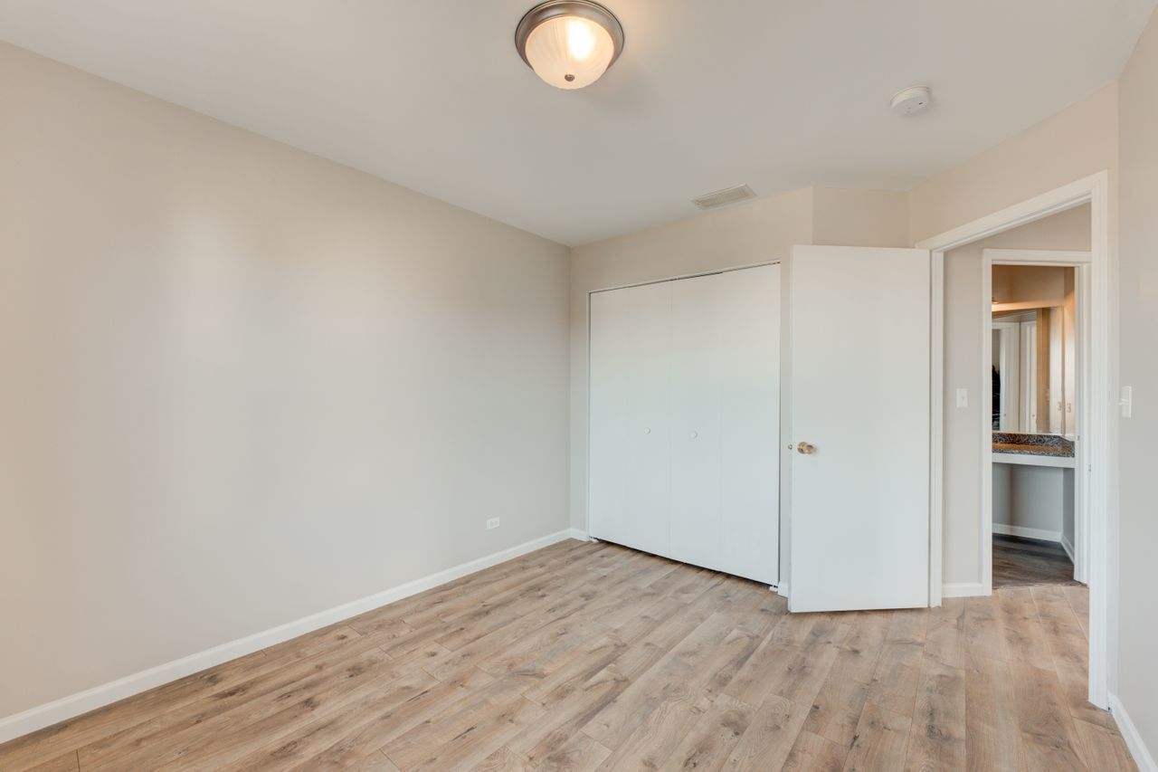 277 Springbrook Trail South Oswego, IL 60543 - Photo 17 of 28 a view of an empty room and wooden floor