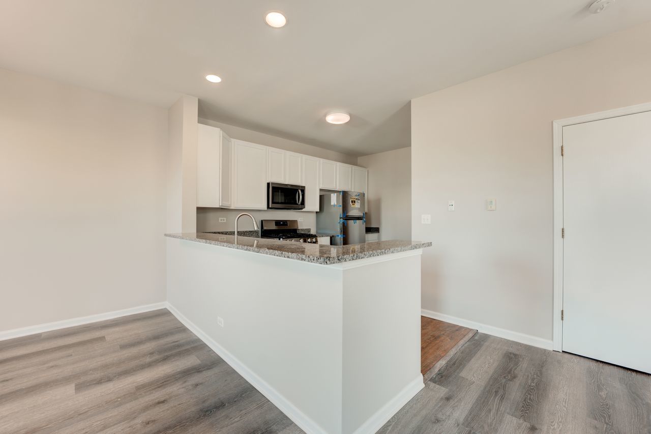 277 Springbrook Trail South Oswego, IL 60543 - Photo 18 of 28 a view of kitchen with stainless steel appliances granite countertop a refrigerator sink and microwave