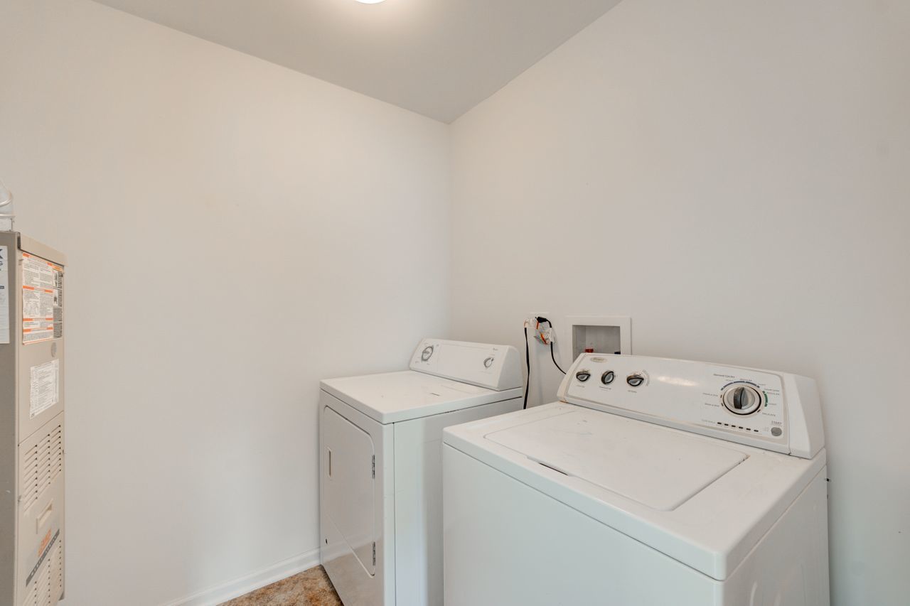 277 Springbrook Trail South Oswego, IL 60543 - Photo 26 of 28 a utility room with dryer and washer