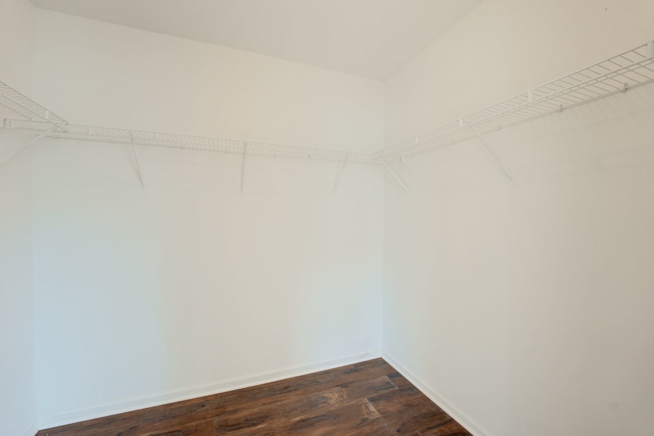 277 Springbrook Trail South Oswego, IL 60543 - Photo 27 of 28 a view of a small space with wooden floor and a window