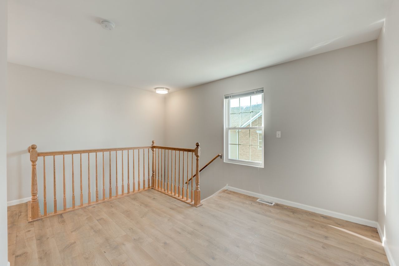 277 Springbrook Trail South Oswego, IL 60543 - Photo 8 of 28 a view of an empty room with a window