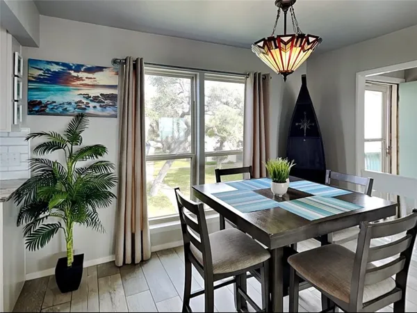 a view of a dining room with furniture window and outside view