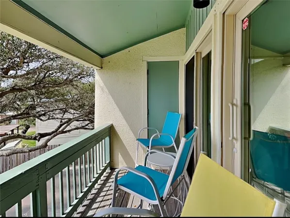 a view of balcony with furniture