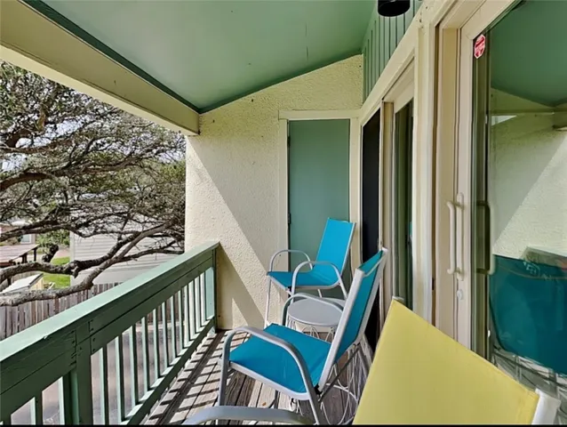 a view of balcony with furniture