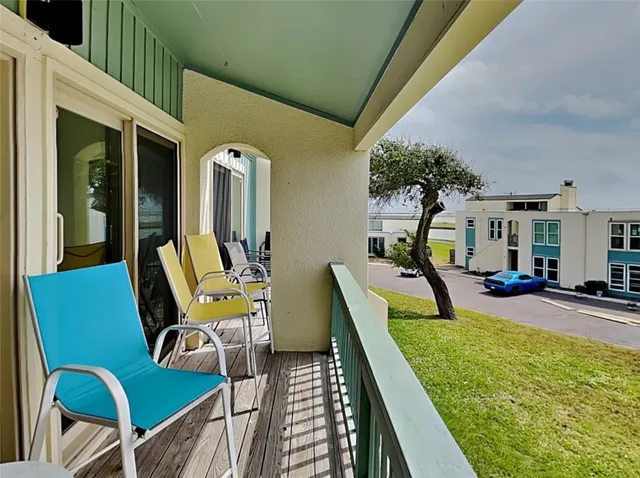 a view of a swimming pool with chairs