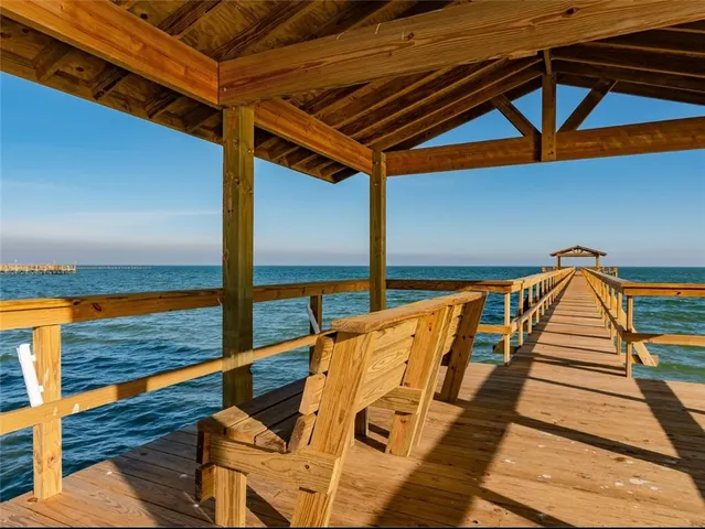 a view of swimming pool with seating area
