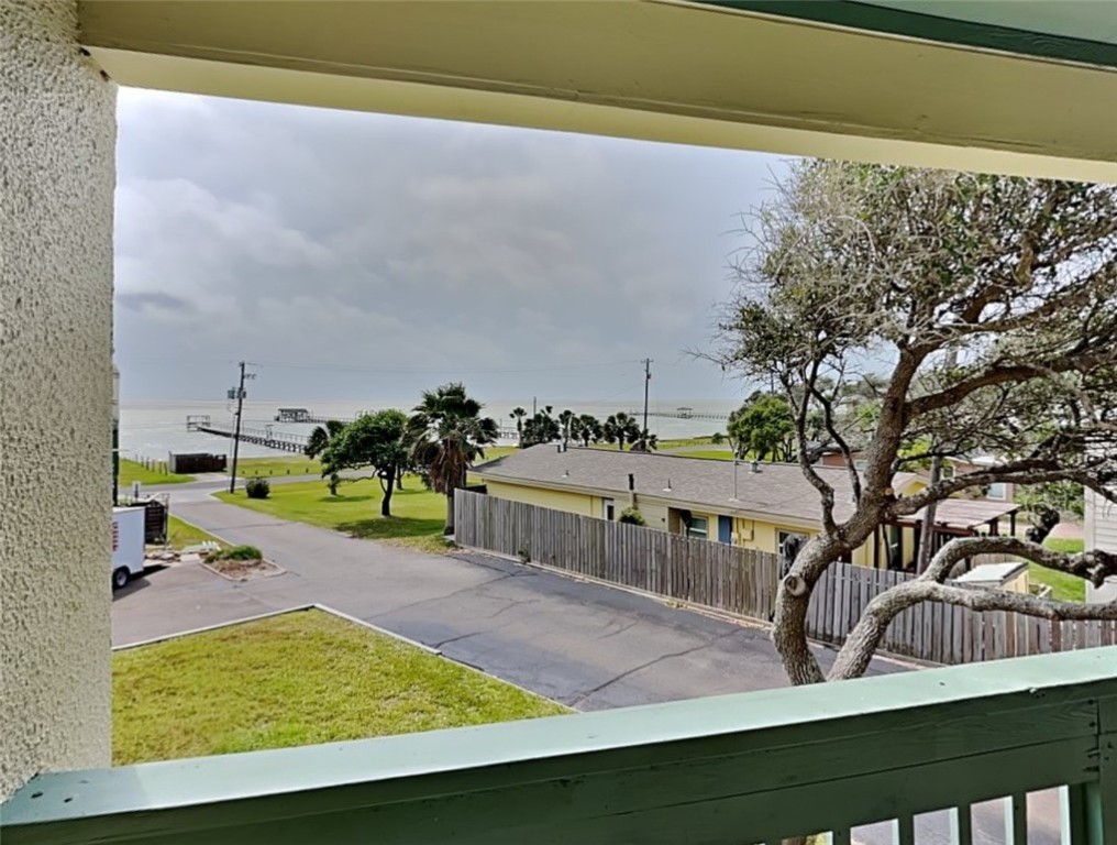 2003 North Fulton Beach Road, Unit 14 Rockport, TX 78382 - Photo 27 of 30 a view of swimming pool with seating area and trees in the background