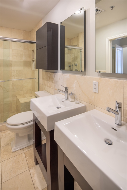 11 Wyman Street, Unit 2B Boston, MA 02130 - Photo 8 of 11 a bathroom with a sink and a toilet