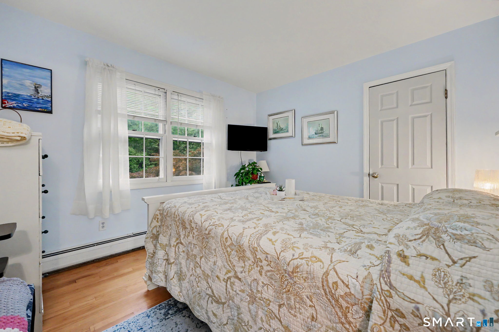571 Wheeler Road Monroe, CT 06468 - Photo 20 of 40 a bedroom with a bed and wooden floor