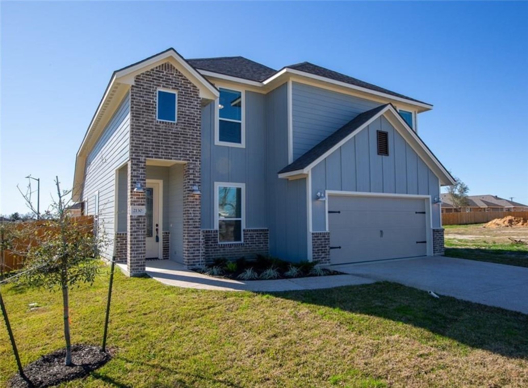 a view of house with backyard and swimming pool