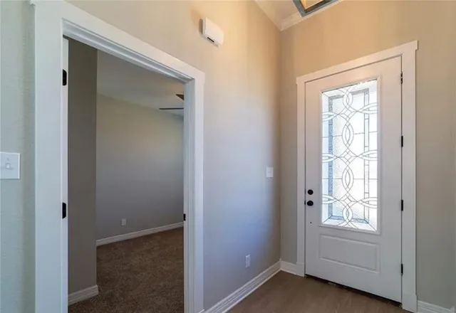 a view of empty room with windows