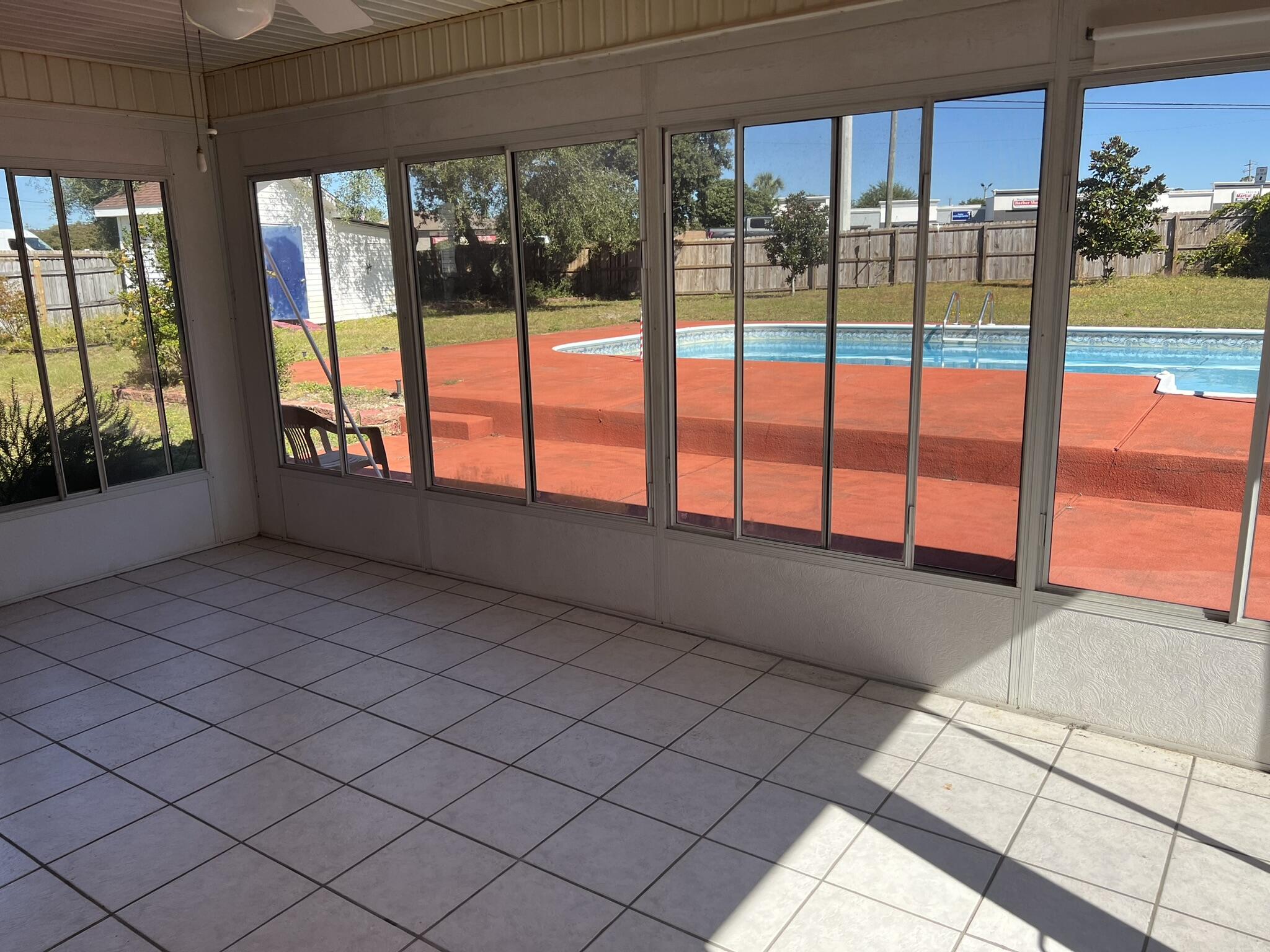 1937 Jessica Way Navarre, FL 32566 - Photo 23 of 39 Sunroom overlooking Pool