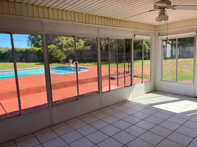 a view of an empty room and window