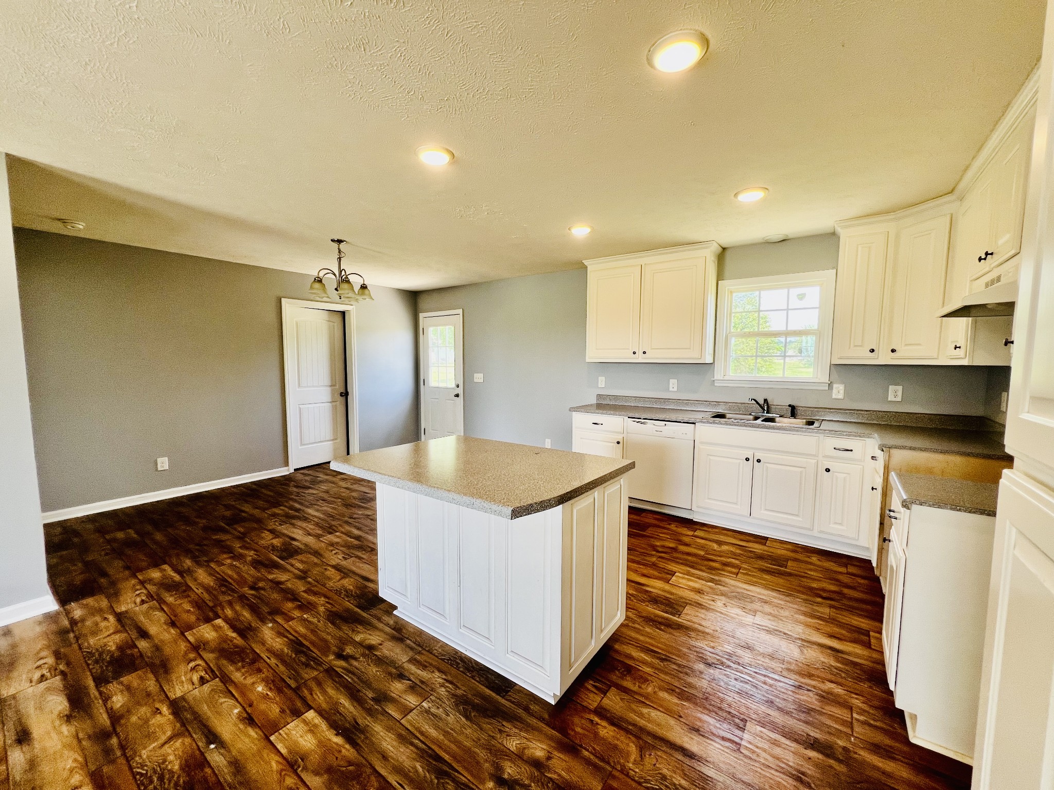 4560 Fall River Road Pulaski, TN 38478 - Photo 18 of 28 a kitchen with granite countertop a sink and cabinets