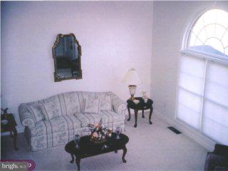 310 Kentucky Avenue Sinking Spring, PA 19608 - Photo 2 of 6 a living room with furniture and a chair