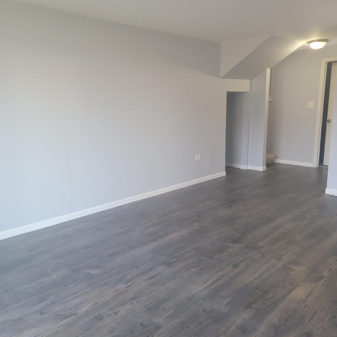 217 Pheasant Road Matteson, IL 60443 - Photo 20 of 27 a view of an empty room with wooden floor