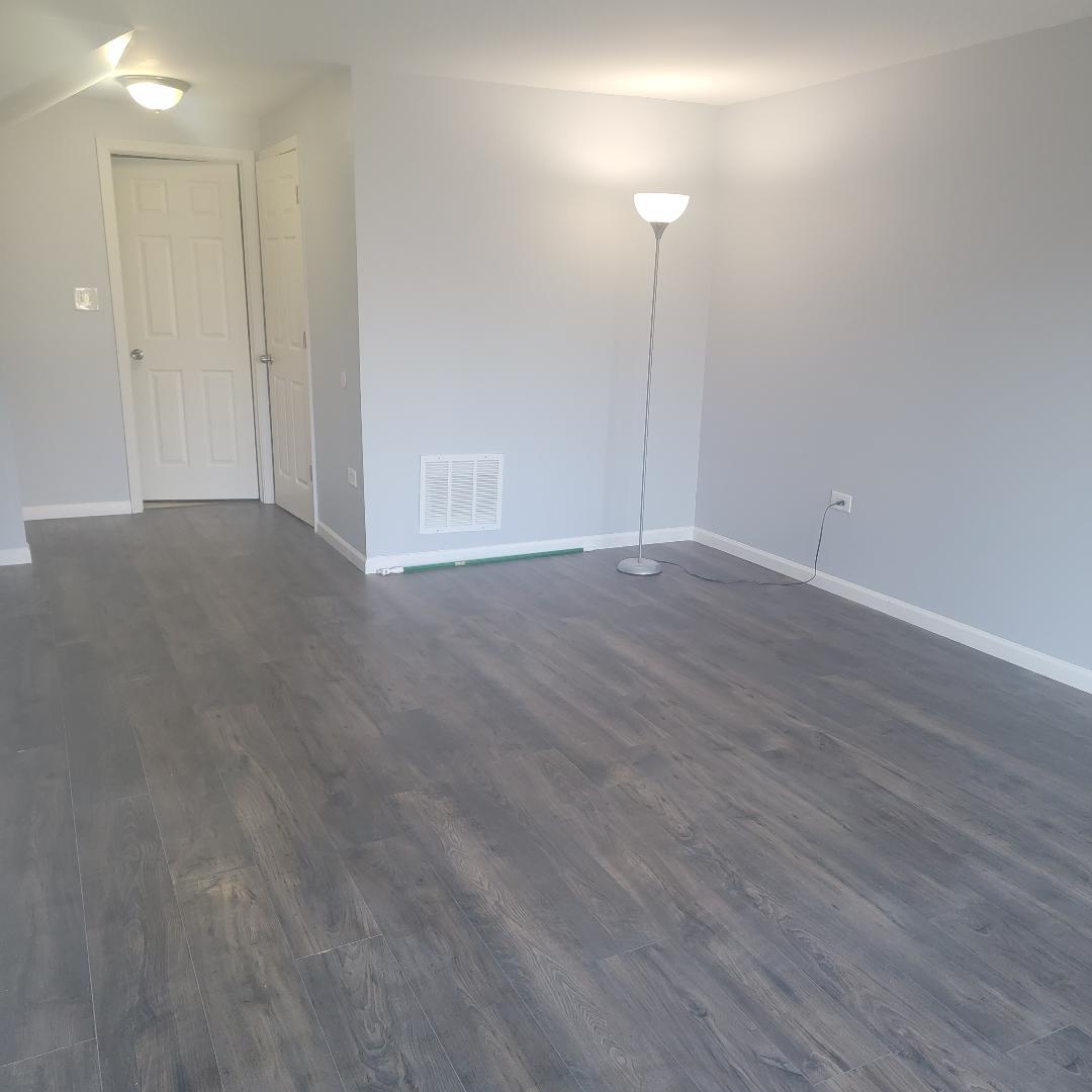 217 Pheasant Road Matteson, IL 60443 - Photo 21 of 27 a view of an empty room with wooden floor and a window