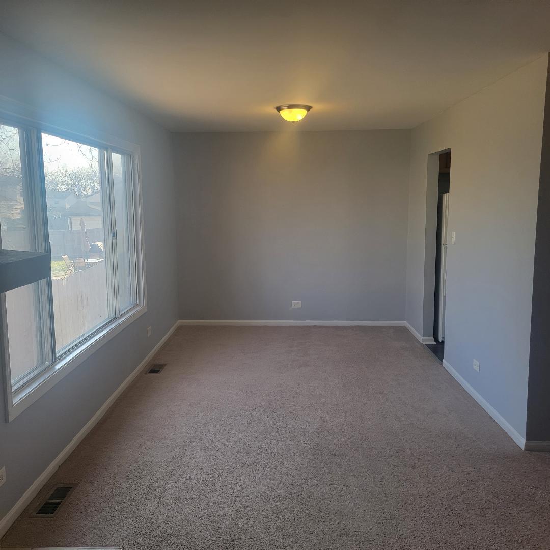 217 Pheasant Road Matteson, IL 60443 - Photo 5 of 27 a view of a room that has a window in it