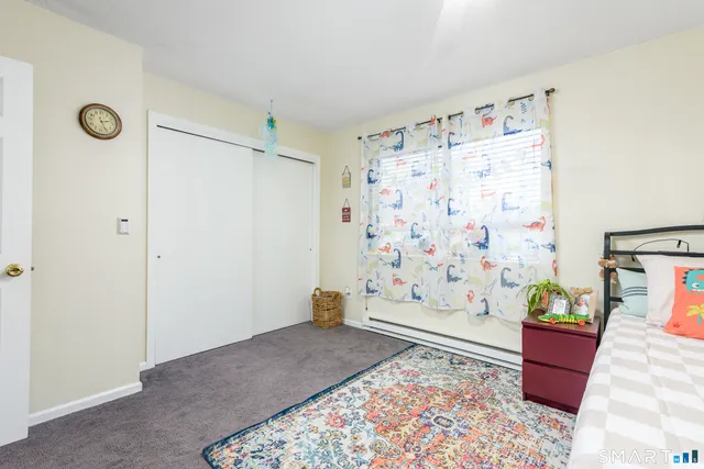 a living room with furniture and a rug