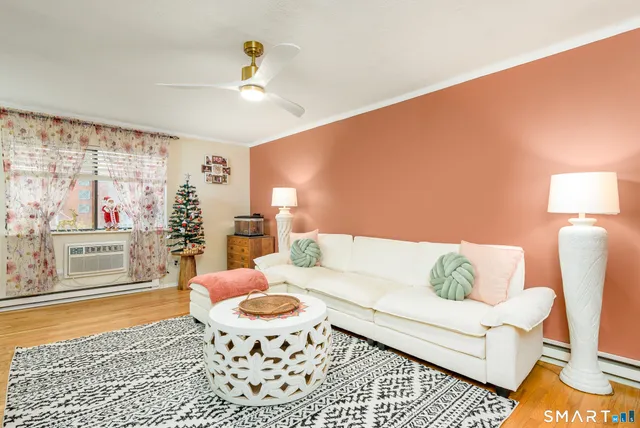 a living room with furniture and a rug