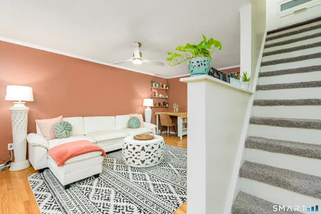 a living room with furniture and a rug