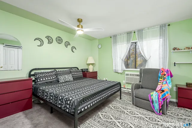 a bedroom with a bed and window