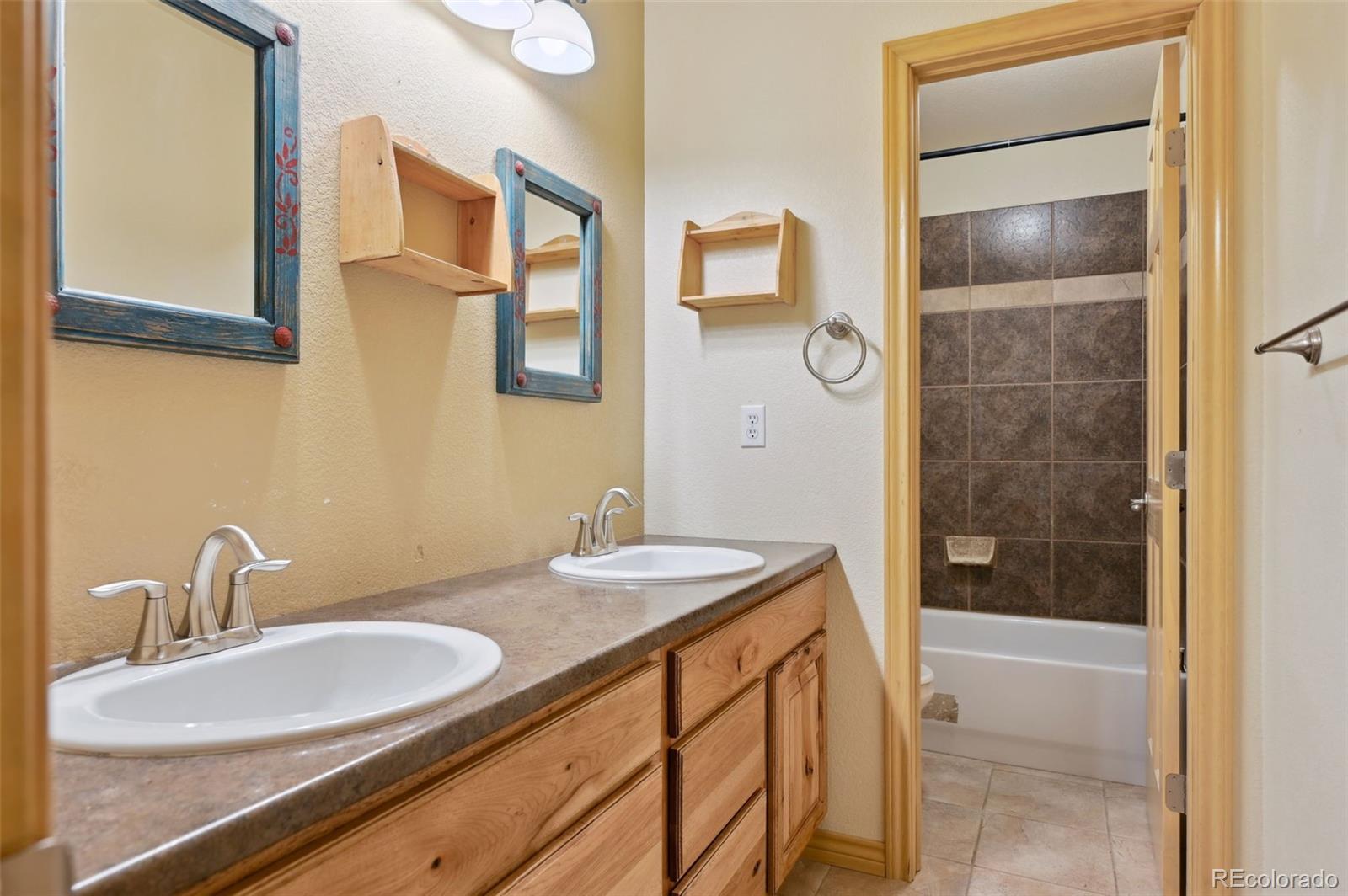 1625 North Yoder Road Yoder, CO 80864 - Photo 24 of 50 a bathroom with a sink a toilet and shower
