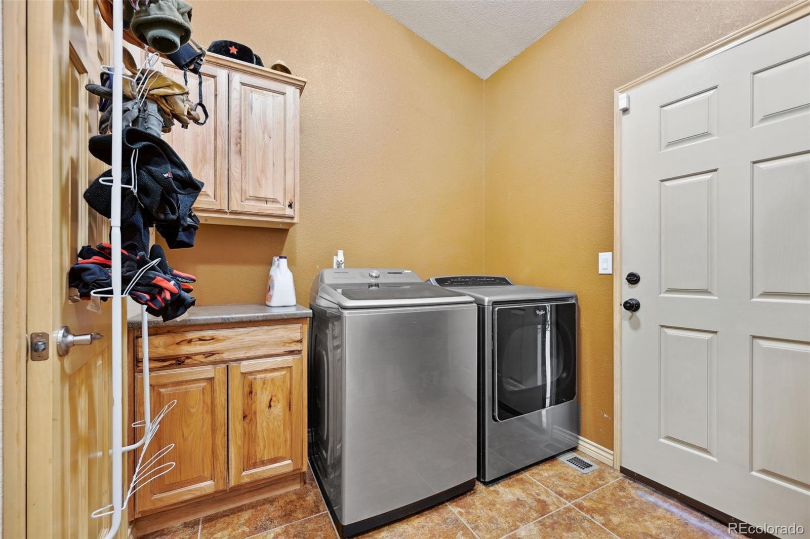 1625 North Yoder Road Yoder, CO 80864 - Photo 35 of 50 a utility room with dryer and washer