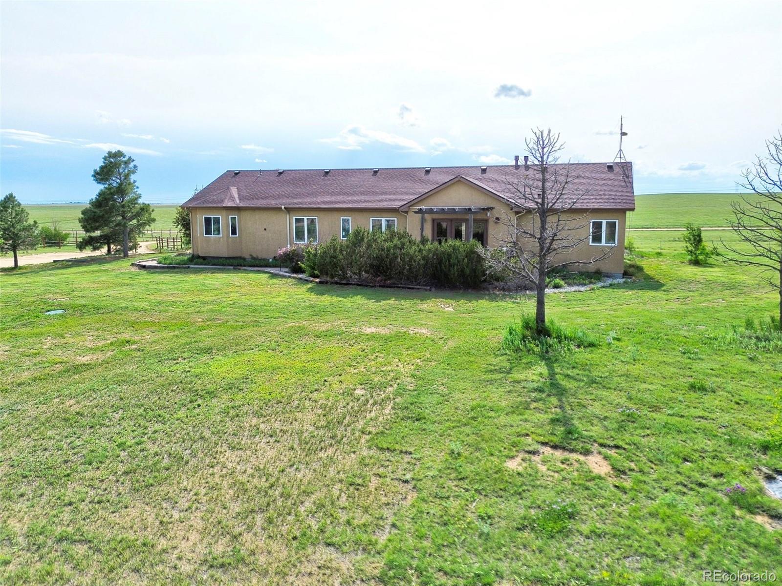 1625 North Yoder Road Yoder, CO 80864 - Photo 48 of 50 a front view of a house with garden