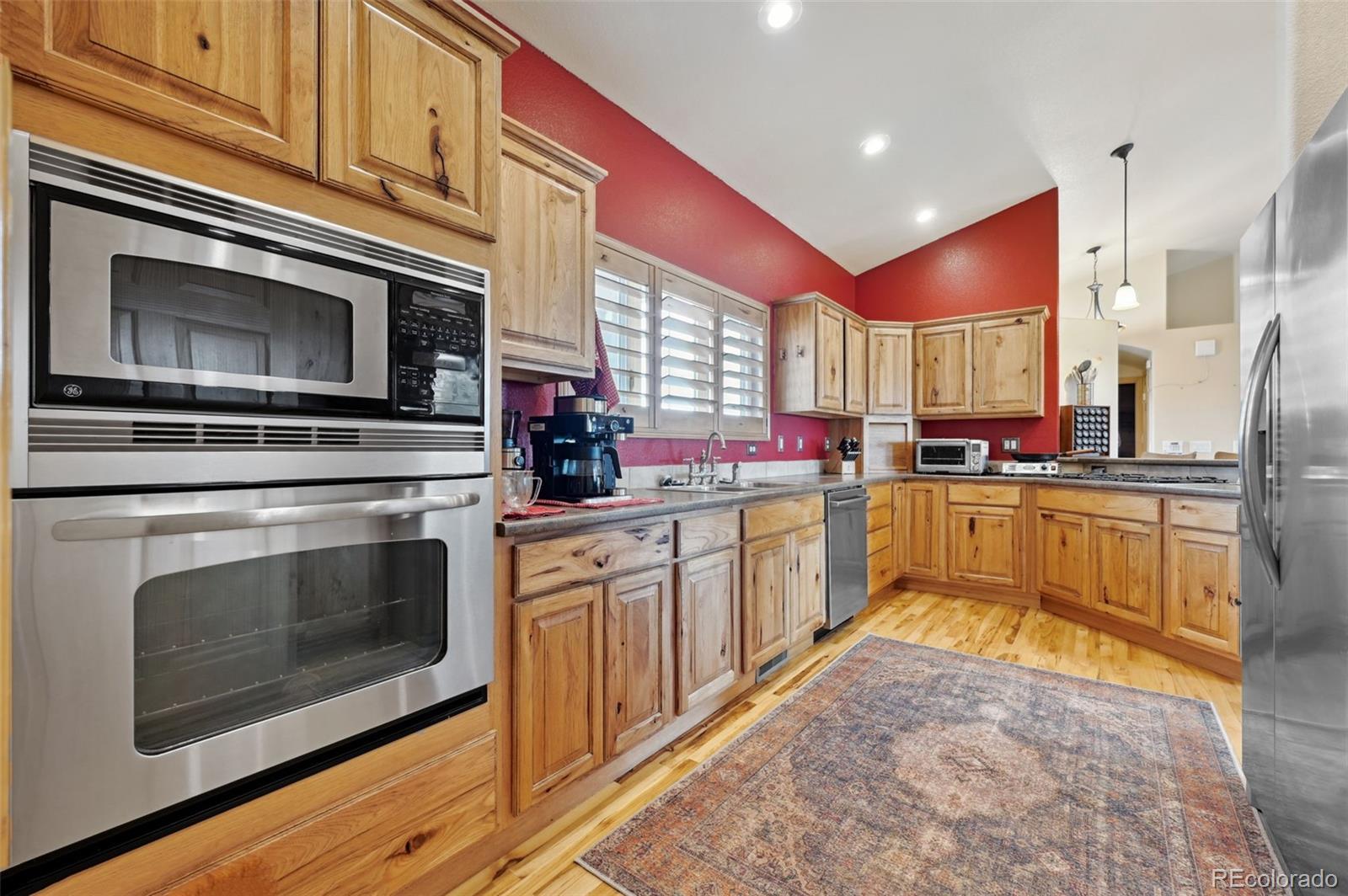 1625 North Yoder Road Yoder, CO 80864 - Photo 6 of 50 a kitchen with stainless steel appliances granite countertop a stove a sink and a microwave