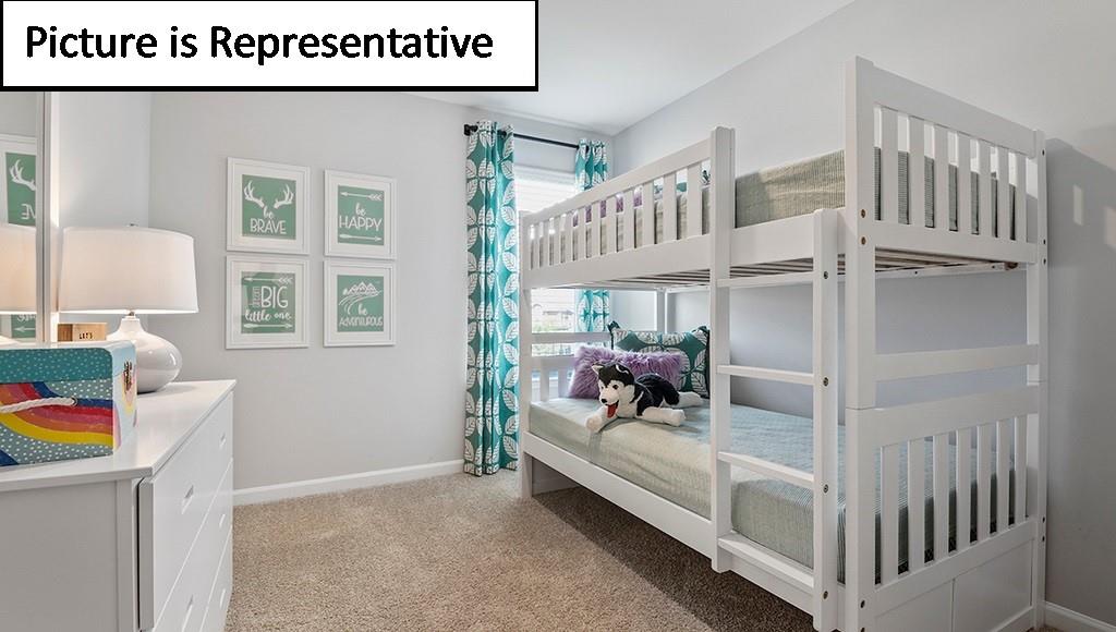 7120 North Mill Road Charlotte, NC 28216 - Photo 21 of 26 a bedroom with furniture and a window