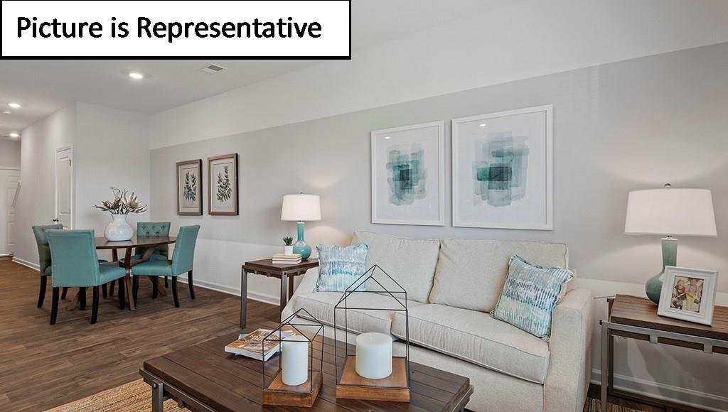 7120 North Mill Road Charlotte, NC 28216 - Photo 7 of 26 a living room with furniture and wooden floor